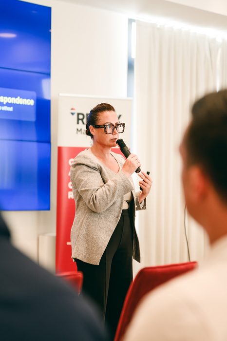 Alexia Stafrace speaking on emotional intelligence at a live event