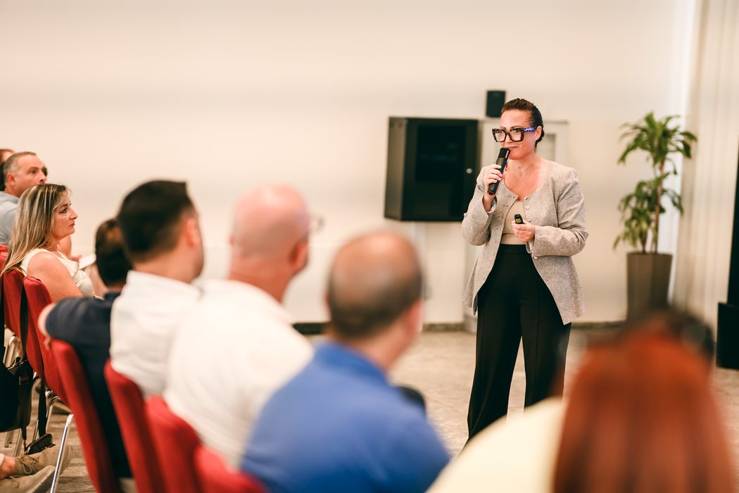 Alexia Stafrace speaking on emotional intelligence at a live event